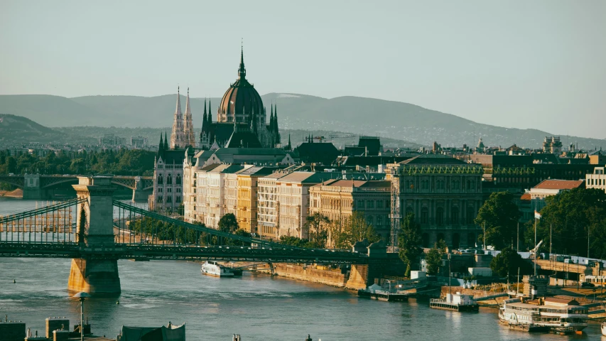 the beautiful city of budapest with an old bridge