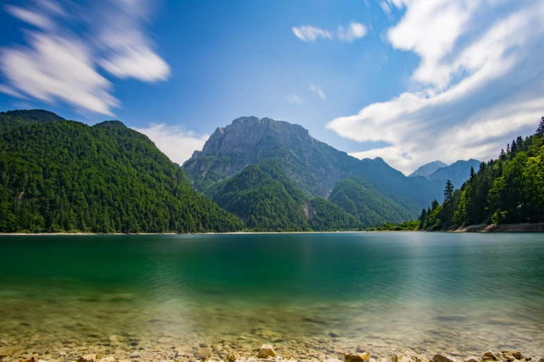 a mountain that is sitting near water and land