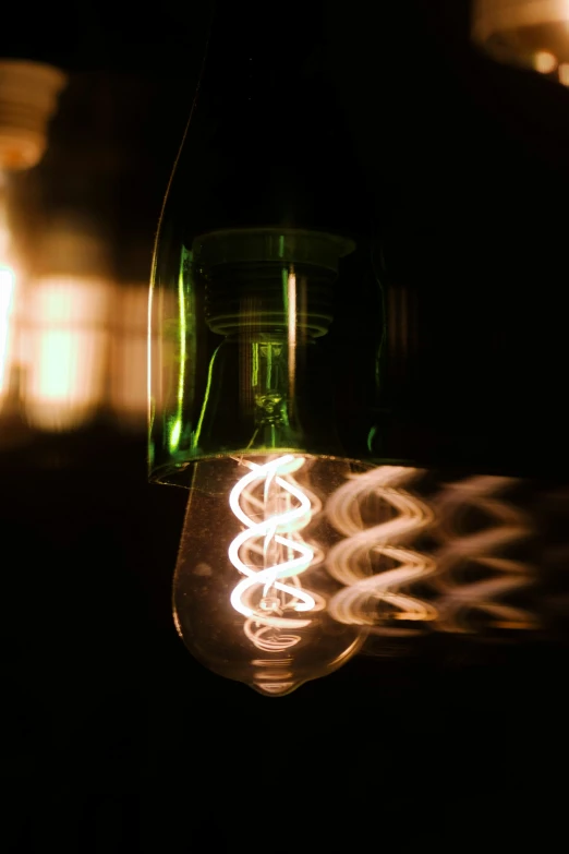 a lighted bottle with light coming out of it