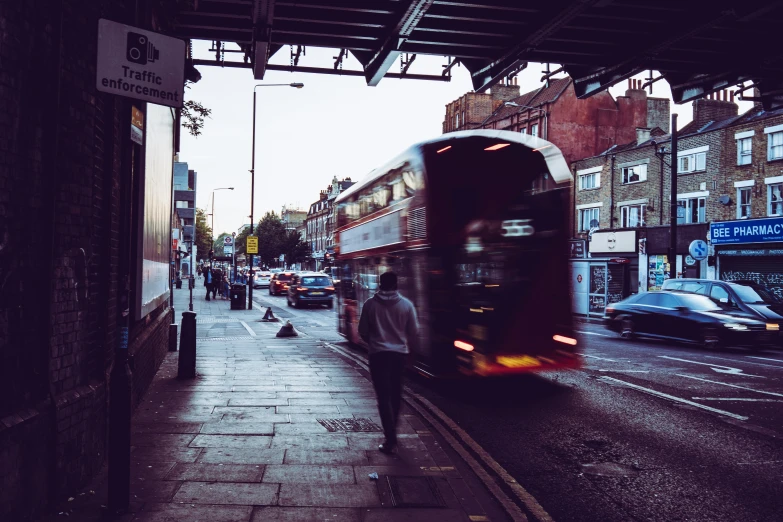 there is a bus that is coming up the street