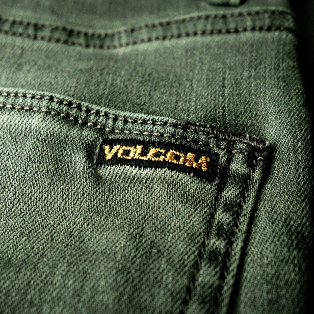 the word violem is shown in gold on a black and brown logo