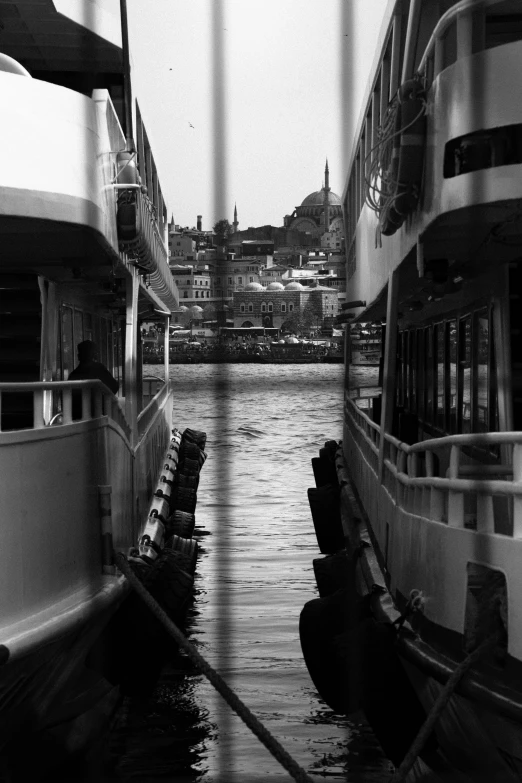 a very long narrow waterway with several large boats docked