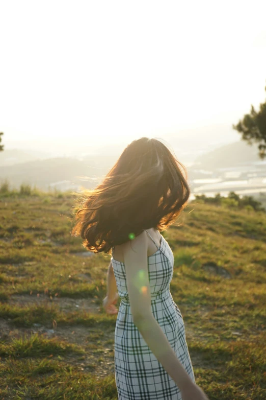 a woman with hair flying in the air