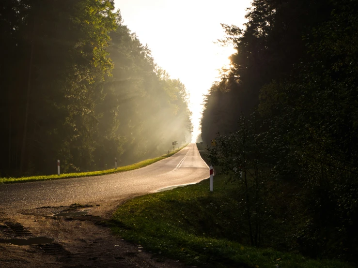 a car driving down the road during the day