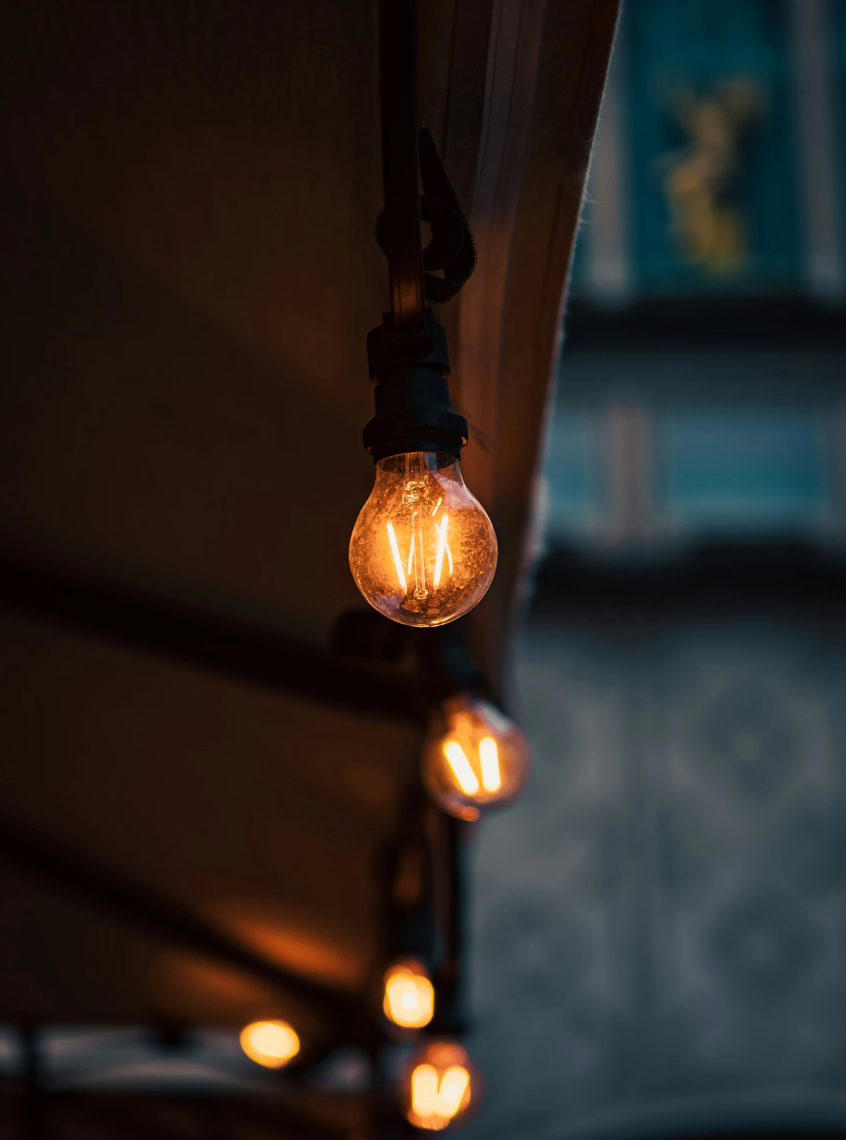 an outdoor light hanging from a building