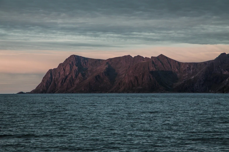 some hills sit at the top of some water