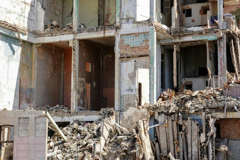 a destroyed building with a bunch of rubble on it