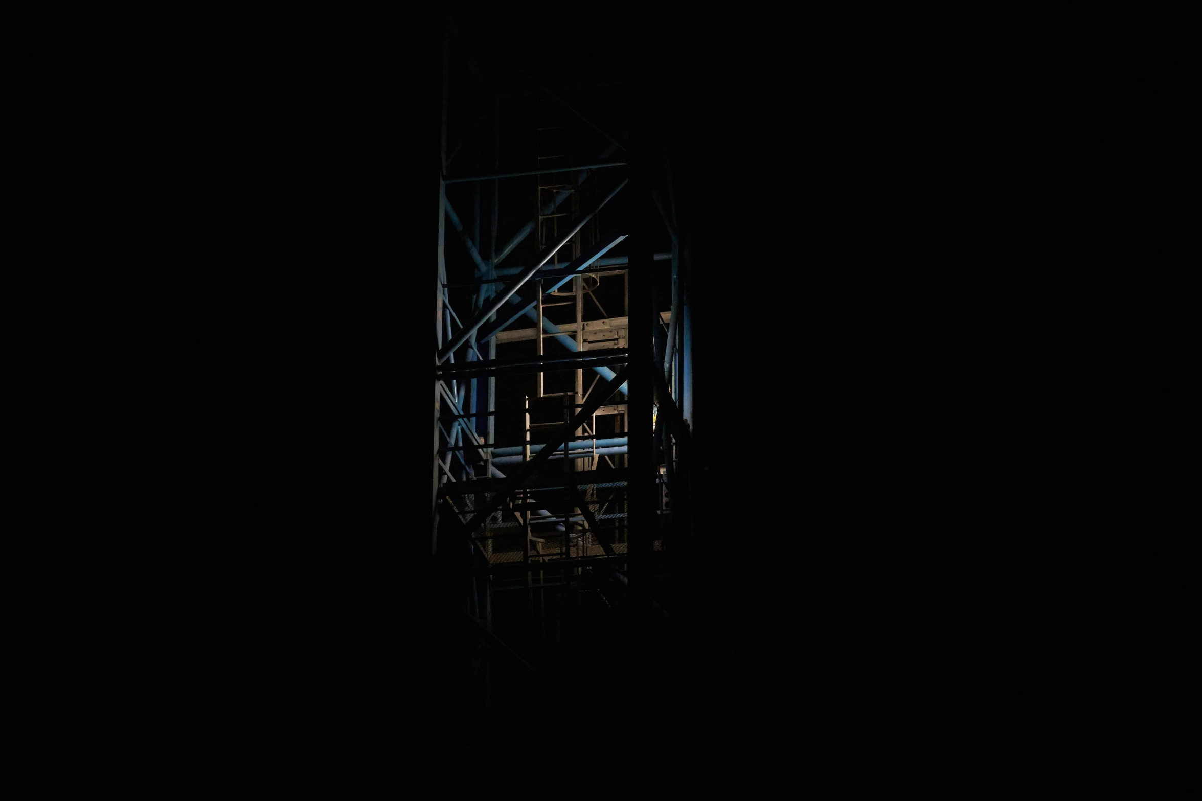 a very tall clock tower with lots of dark walls