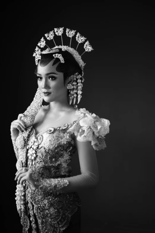 a woman in a fancy dress with a headpiece