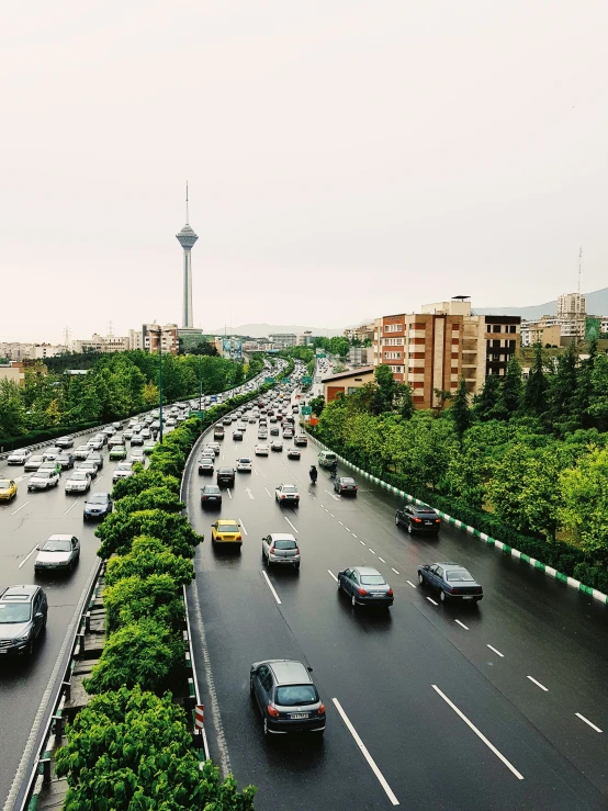 a highway with cars driving along side it