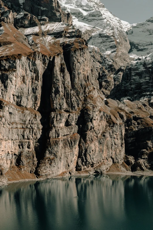 a mountain view of water and rocky mountains