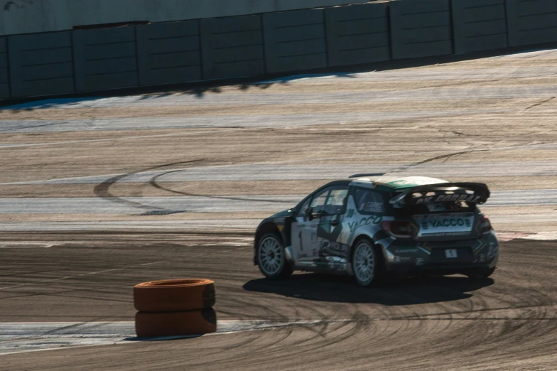 a car racing with its trunk up in the air