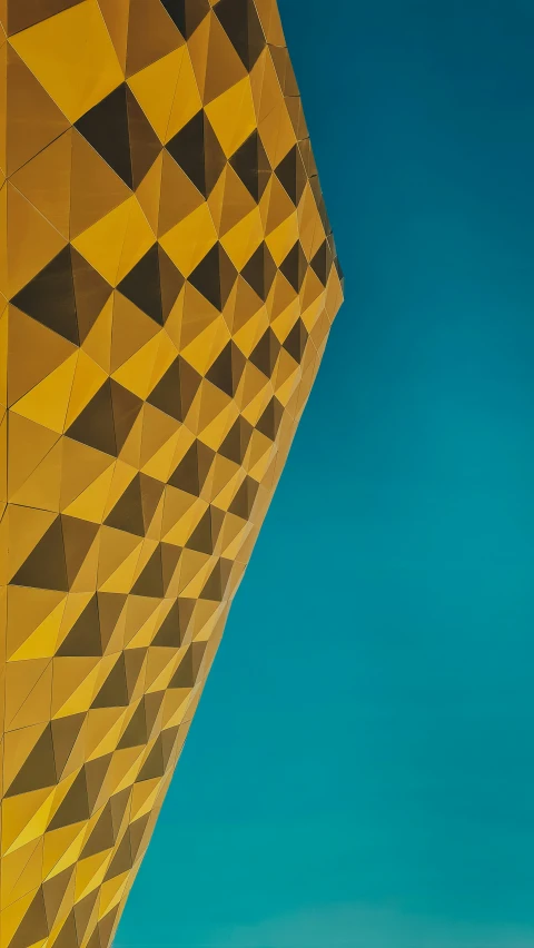 the side of a building with some blue sky in background