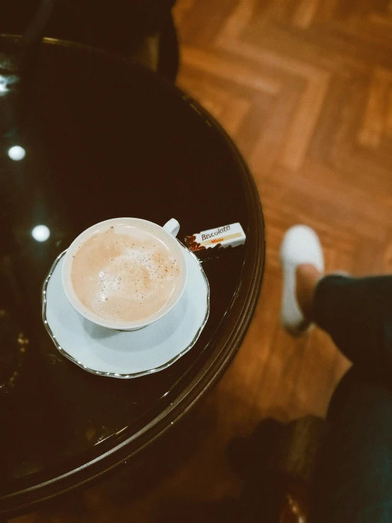 a small glass dish is sitting on a table