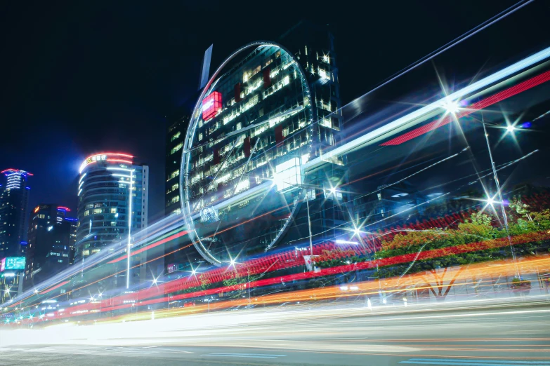 blurred pograph of lights streaks on buildings at night