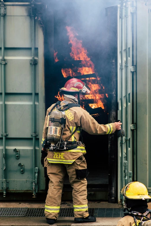 fire fighter looking at the open door