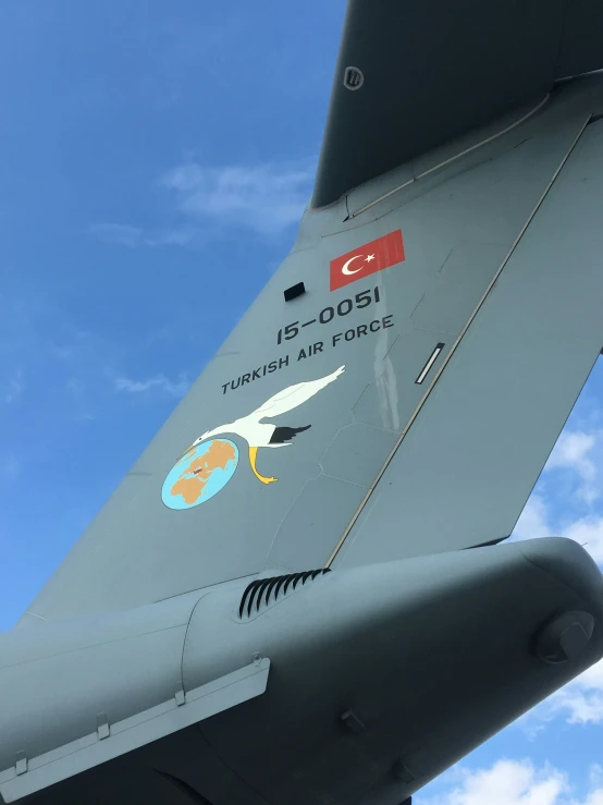 the side of an air force jet, with many stickers