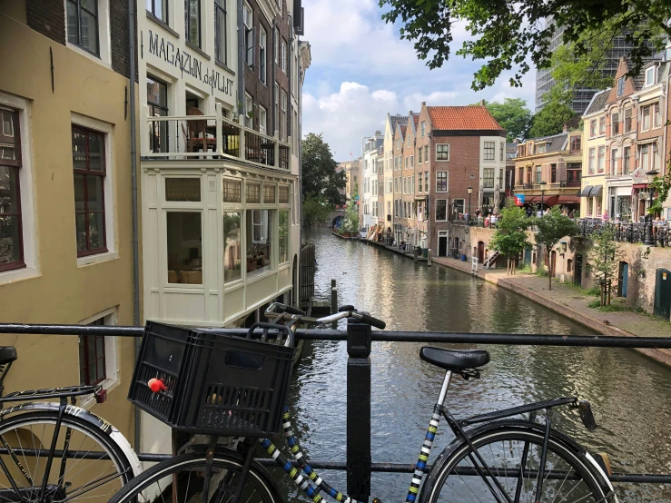 the bikes are parked along the side of a river