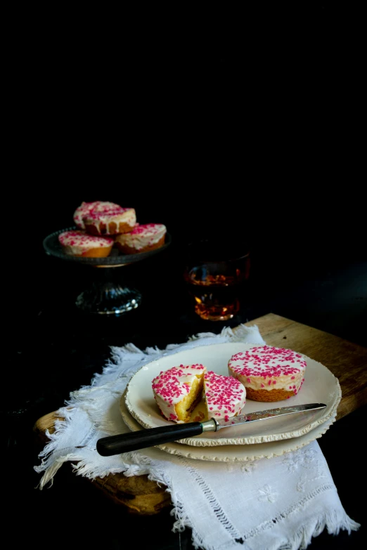 a close up of two desserts on a plate