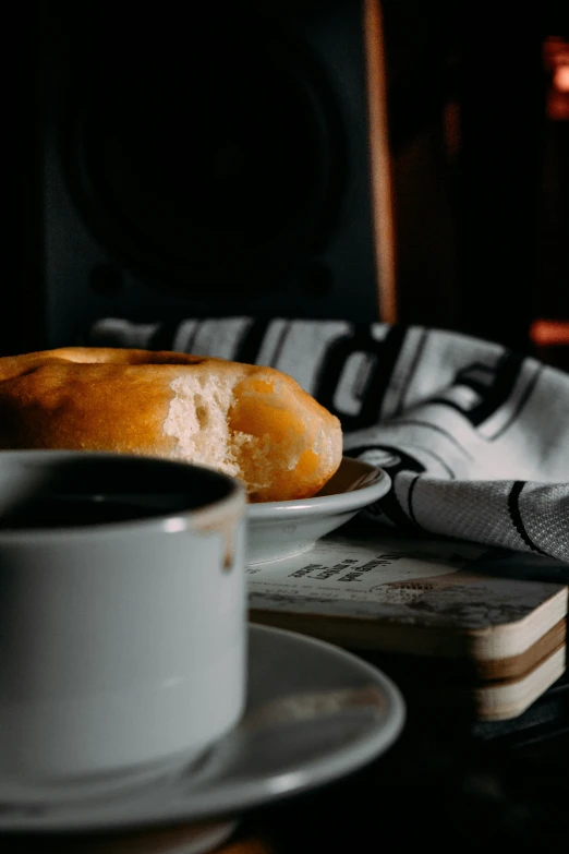 an image of a table with pastries and a cup