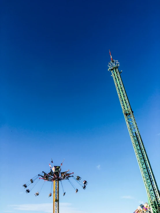 people enjoying the ride and carnival rides