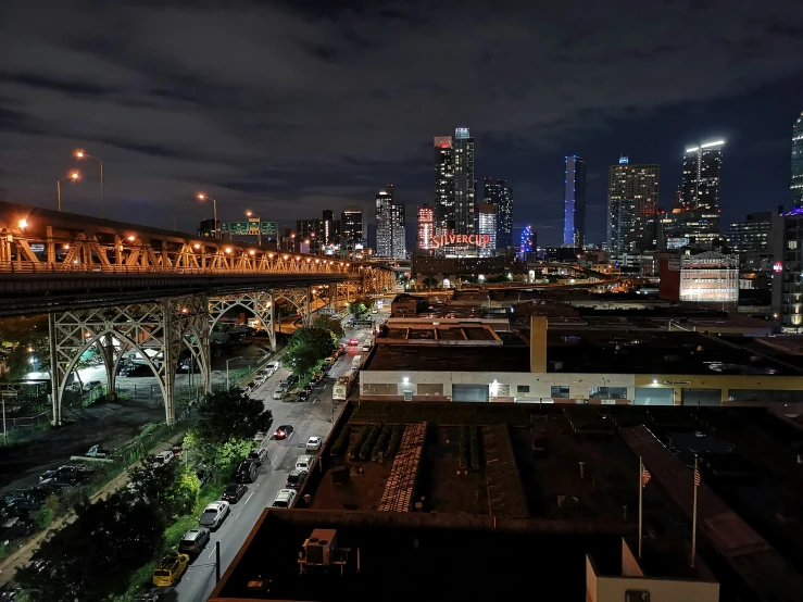 the city skyline is lit up at night