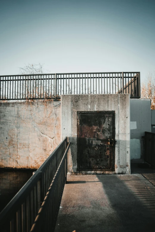 there is a gate with some graffiti on it