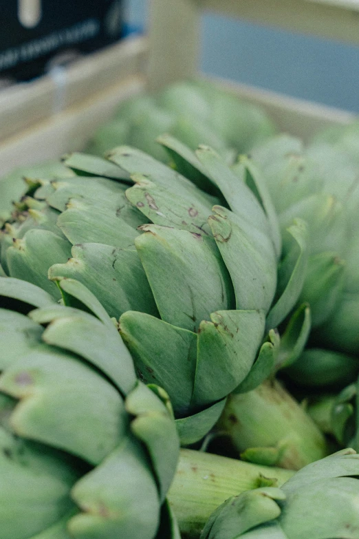 green artichokes stacked on top of each other