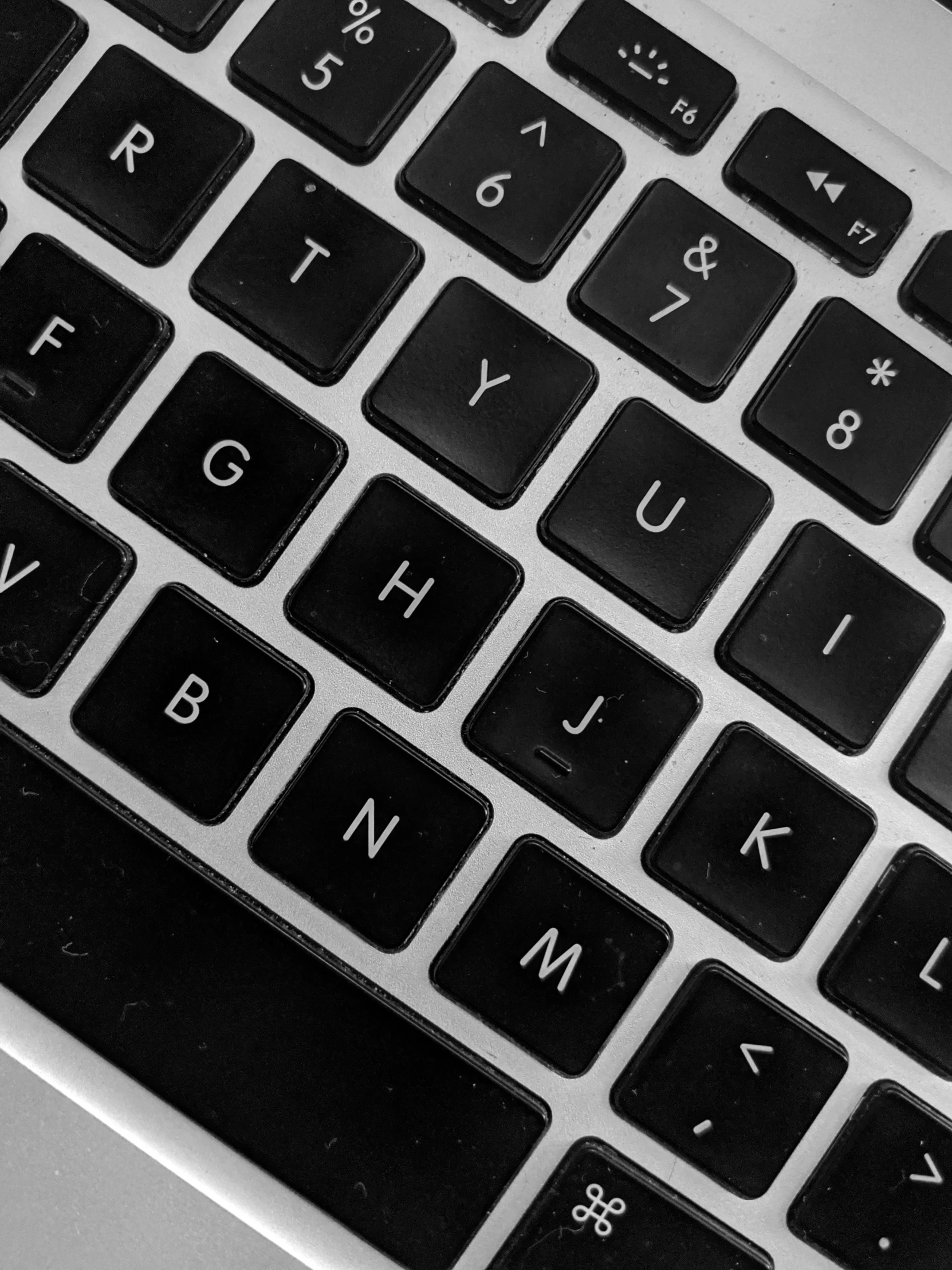 the keyboard of a laptop that has some words on it