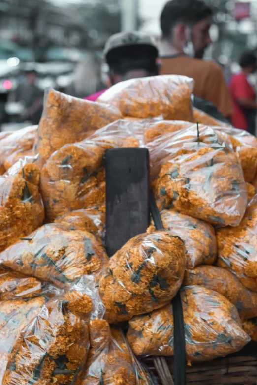 a bunch of bread on a table in front of people