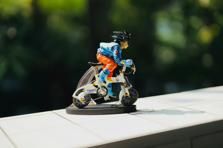 a toy figure sitting on top of a motorcycle