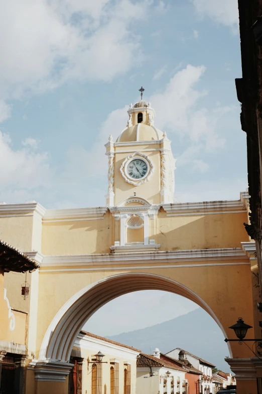 a tall building has a clock on the tower