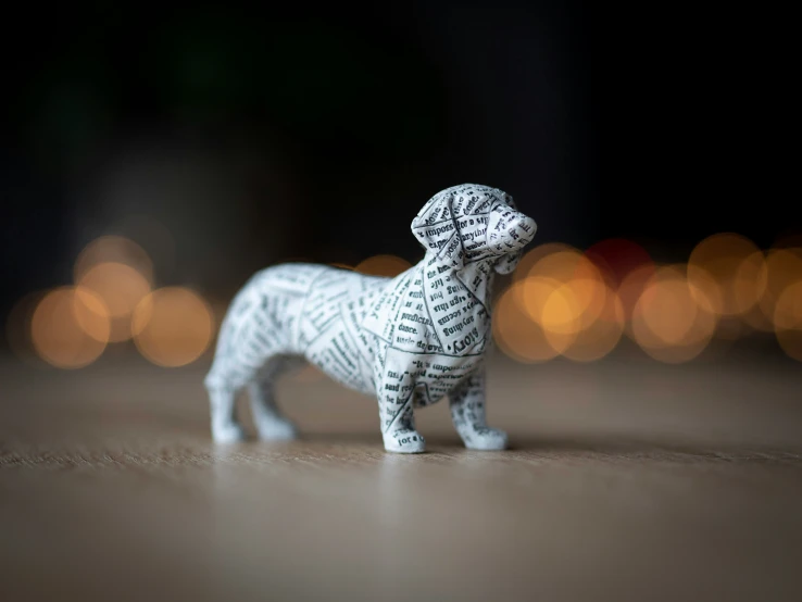 small dog made from cut up newspaper strips