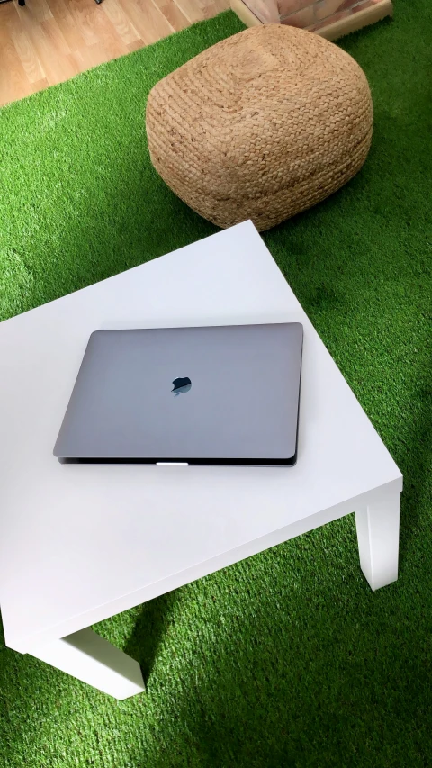 a computer is sitting on top of a table