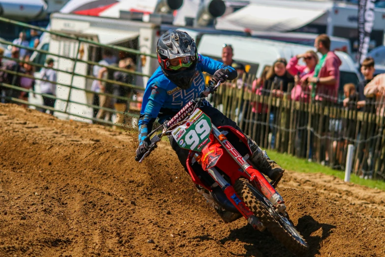 a person riding a motorcycle on a dirt track