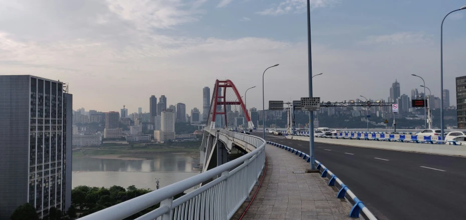 an urban road with a city in the background