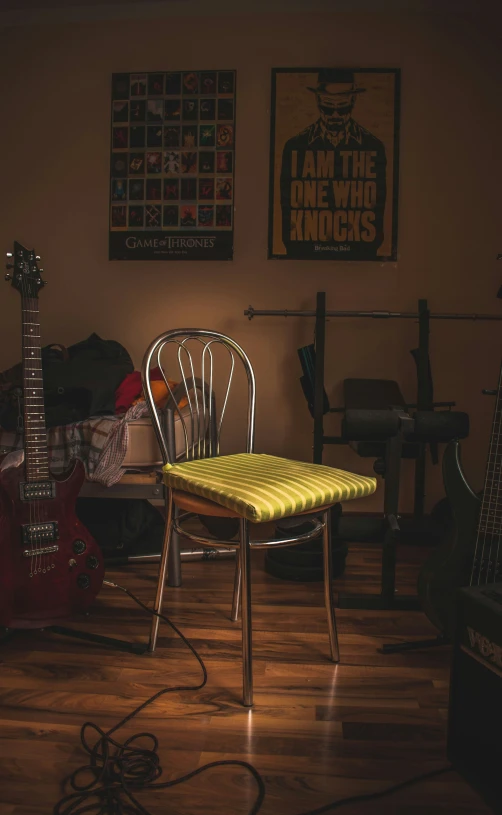 a guitar, guitar and some other musical equipment are lying around