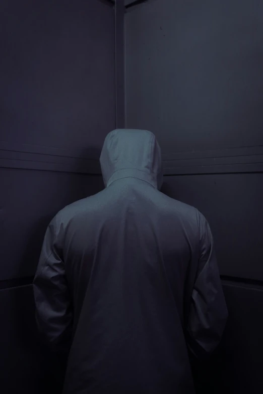 the back of a person standing in an empty room