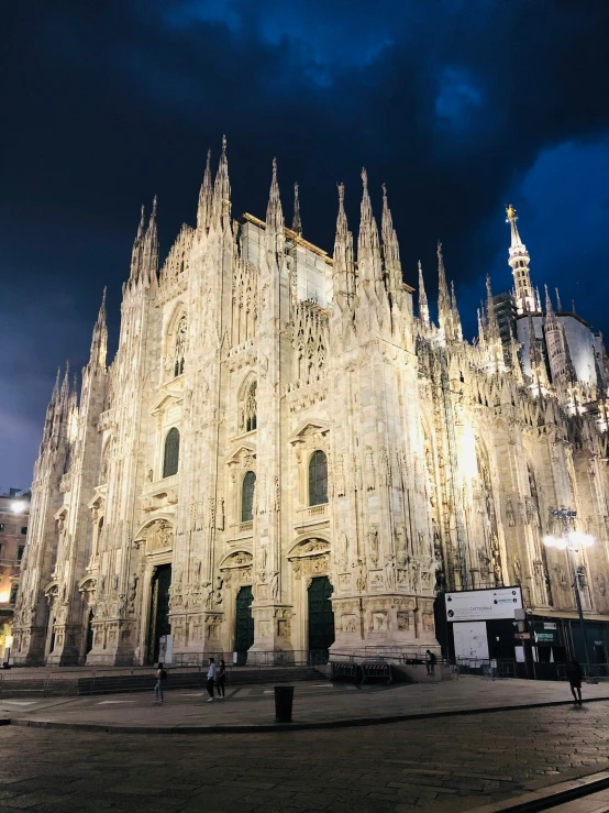 the large cathedral is illuminated up at night