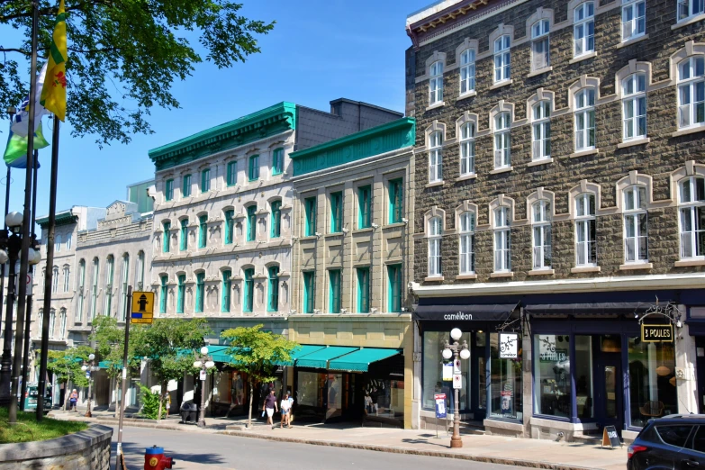 a street with lots of windows that is surrounded by buildings