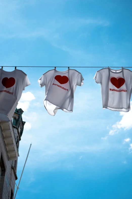 two shirts hung out to dry on the clothesline