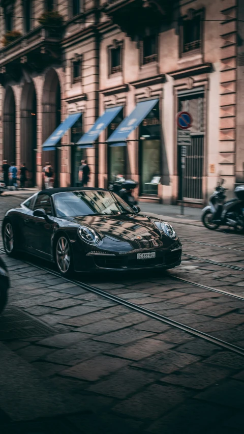 a black sports car parked on the side of the road