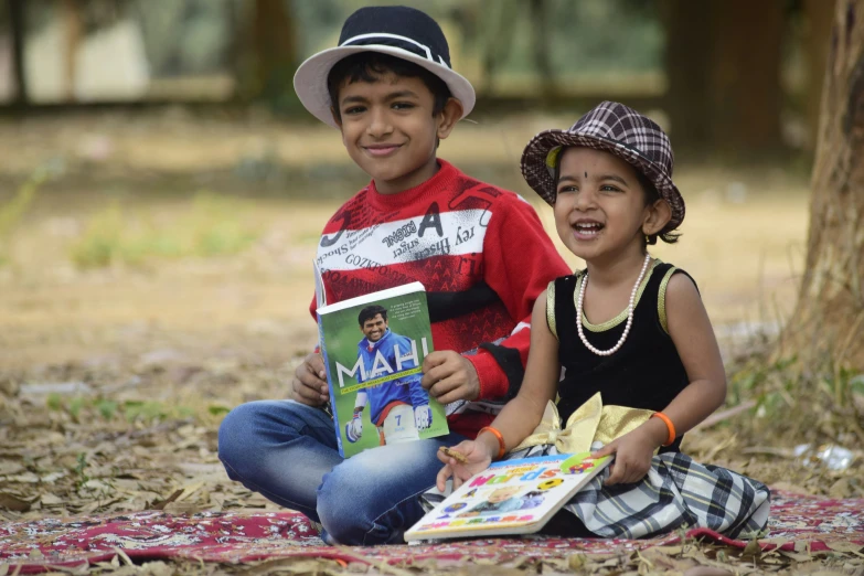 a boy reading a magazine to a 