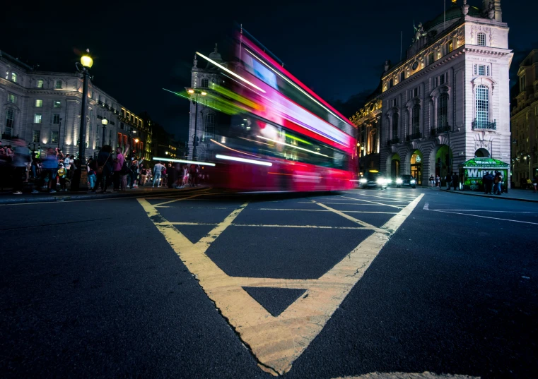 a double decker bus moving down a city street