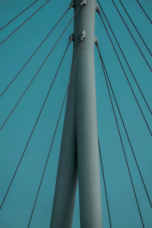 a close up view of the side of a blue and gray suspension structure