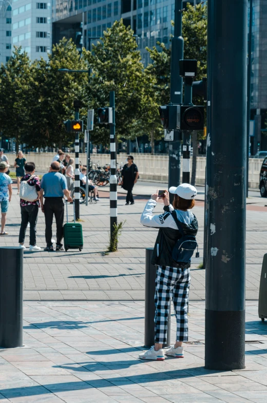 people in pajamas and hats walking down a street