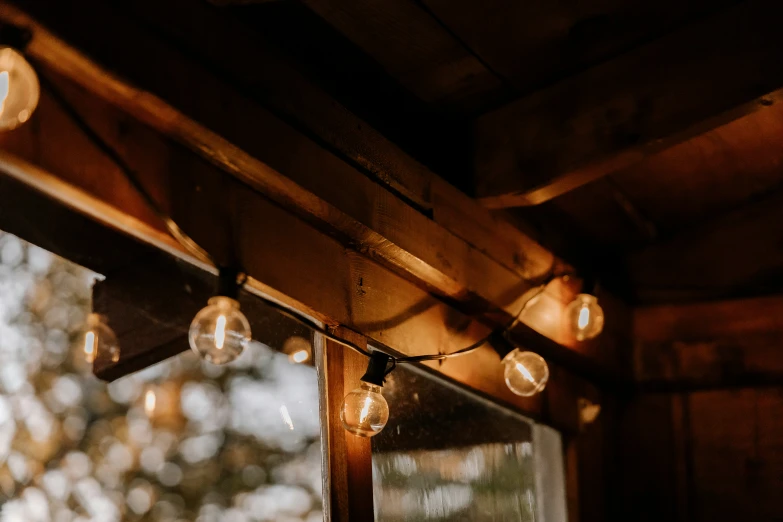 many lamps and balls on top of some wooden buildings