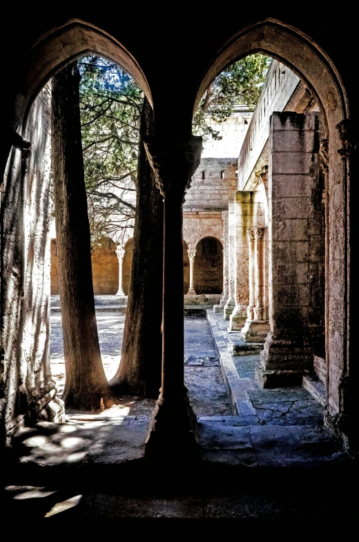 an arched window looking at a courtyard