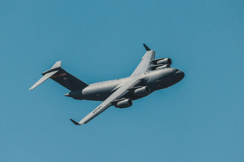 an airplane with a large propeller flying through the sky