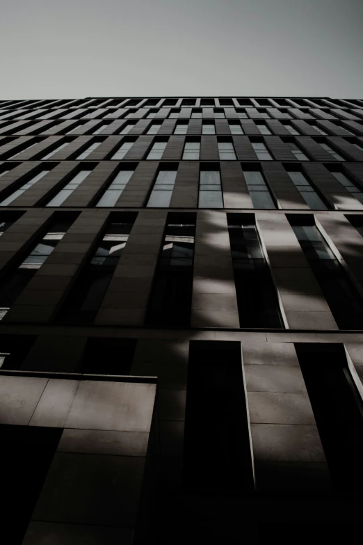 an upward view of a tall building's side